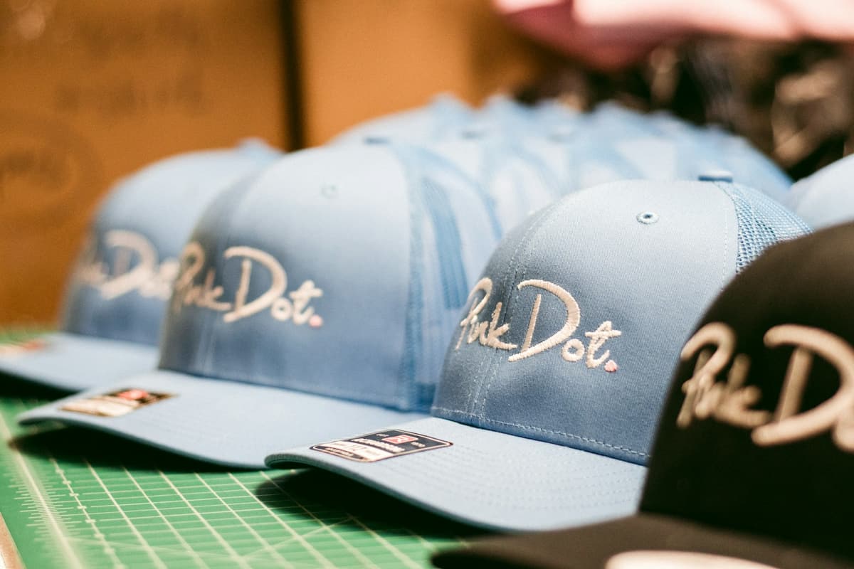 Branded Caps — Front-panel decoration sized to the crown so the mark sits level when worn.